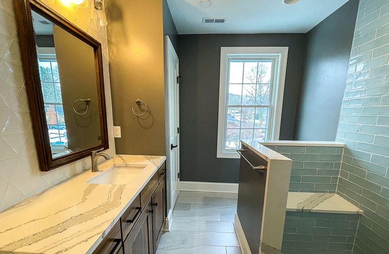 Quartz vanity and a walk in shower, a bathroom remodel by Sidney Design & Build in Winchester, VA