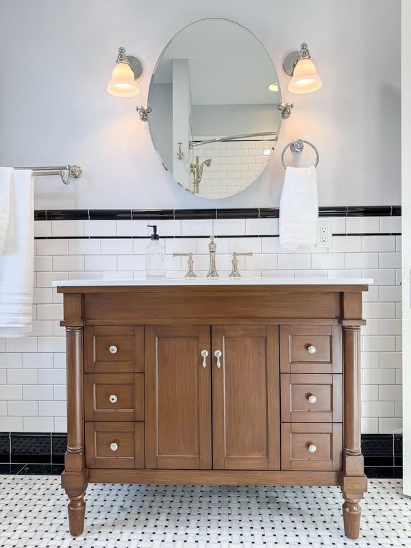 Furniture style vanity and subway tile, a bathroom remodel by Sidney Design & Build in Winchester, VA