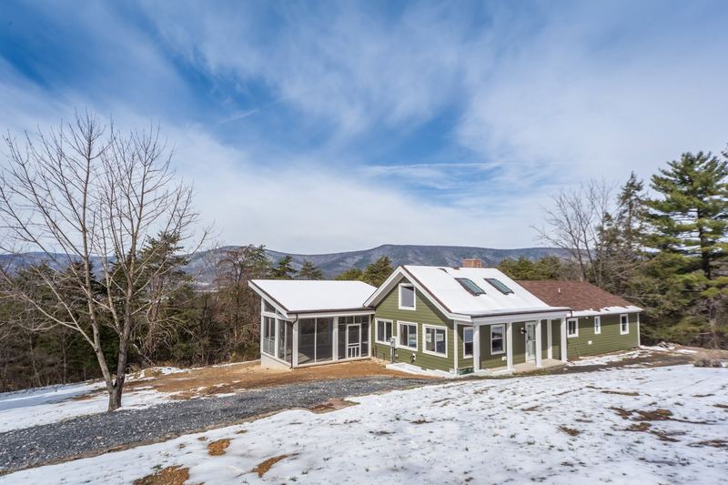 Custom home in winter, a custom home by Sidney Design & Build in Winchester, VA