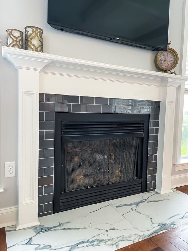 Painted surround and slate tile, a fireplace renovation by Sidney Design & Build in Winchester, VA