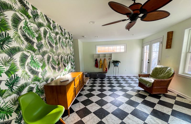 Bold wallpaper and a checkerboard floor, a interior renovation by Sidney Design & Build in Winchester, VA
