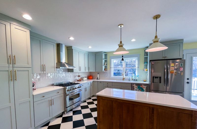 Walnut island on a checkerboard floor, a kitchen remodel by Sidney Design & Build in Winchester, VA