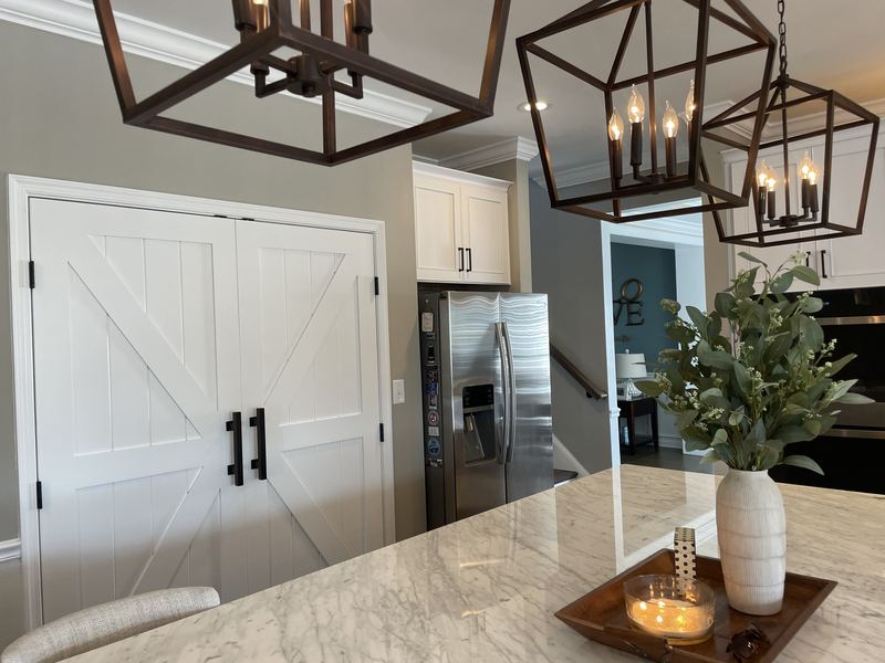 Barn door pantry off the kitchen, a kitchen remodel by Sidney Design & Build in Winchester, VA