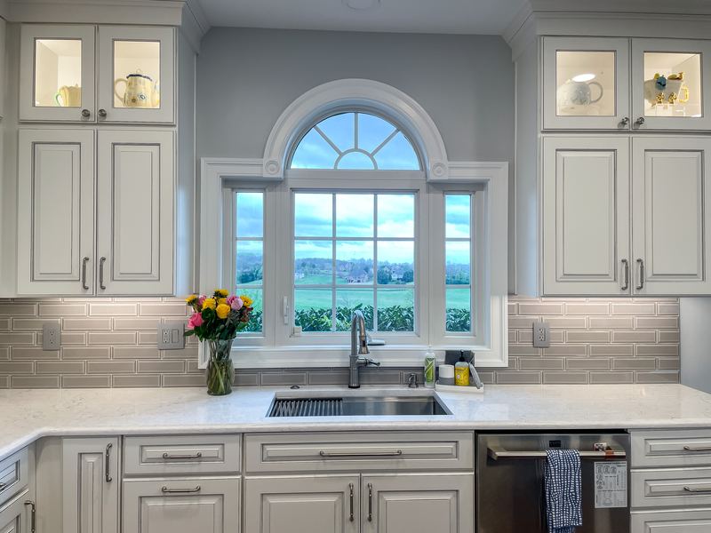 Arched window over the sink, a kitchen remodel by Sidney Design & Build in Winchester, VA