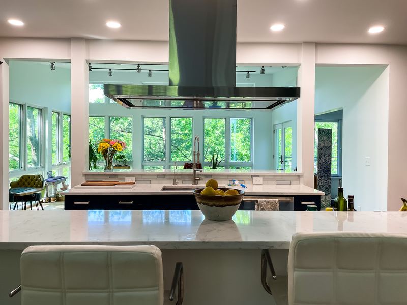 Island hood and a wall of windows, a kitchen remodel by Sidney Design & Build in Winchester, VA