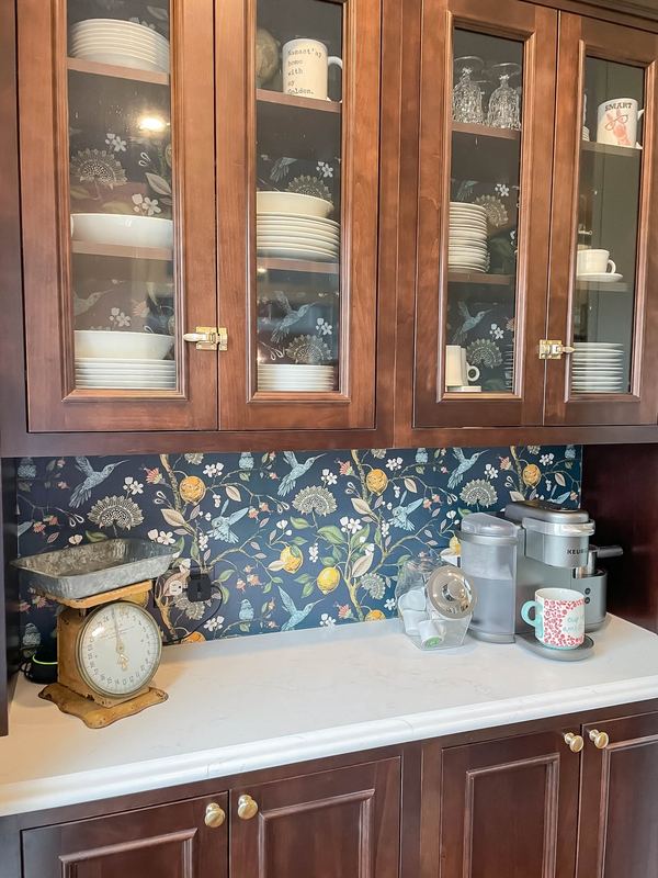 Stained glass front cabinets and a mosaic backsplash, a kitchen remodel by Sidney Design & Build in Winchester, VA