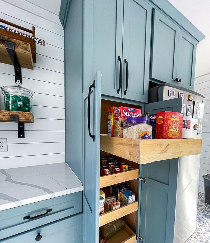 Pull out pantry in the laundry room, a laundry room remodel by Sidney Design & Build in Winchester, VA