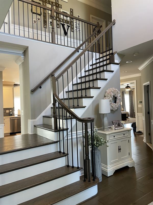 Open staircase with iron balusters, a staircase renovation by Sidney Design & Build in Winchester, VA