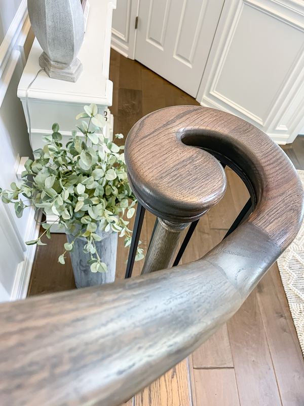 Hand carved handrail detail, a staircase renovation by Sidney Design & Build in Winchester, VA
