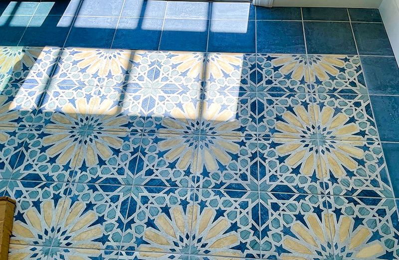 Patterned tile floor, a sunroom addition by Sidney Design & Build in Winchester, VA
