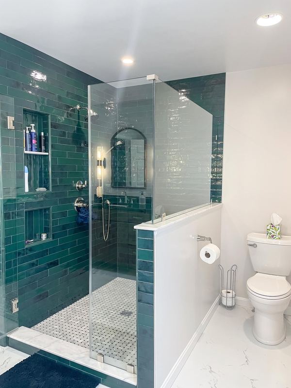 Teal subway tile and glass, a walk in shower by Sidney Design & Build in Winchester, VA