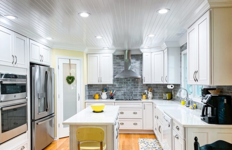 Bright kitchen remodel with white cabinets, a beadboard ceiling and a center island in Winchester, VA
